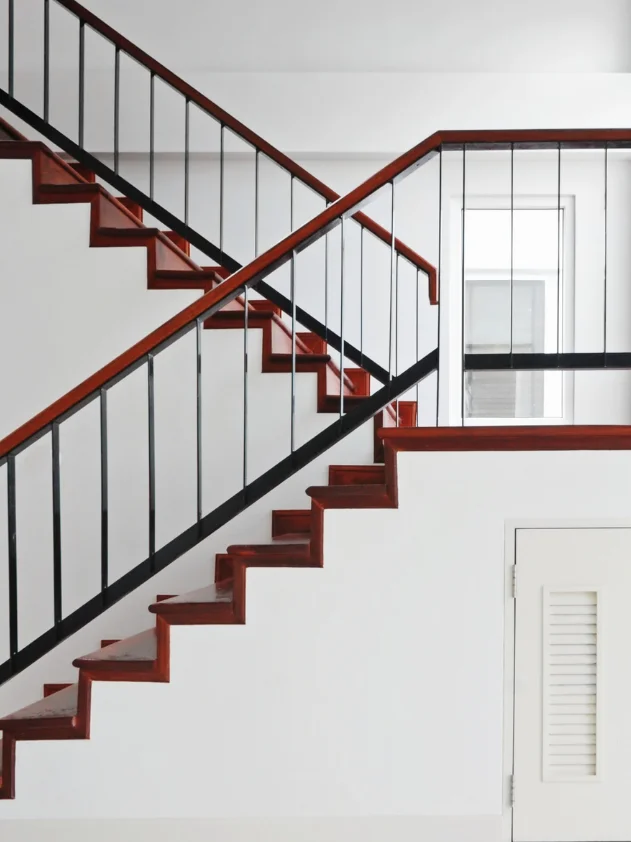 traditional staircase with black railing
